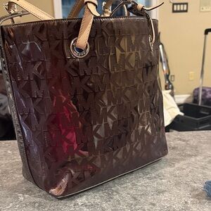 Michael Kors Glossy MK-Embossed Tote in Grey/Silver with Tan Handles
